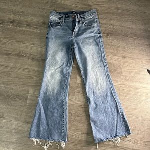 EXPRESS Mid Rise Light Wash Raw Hem 70s Flare Jeans
